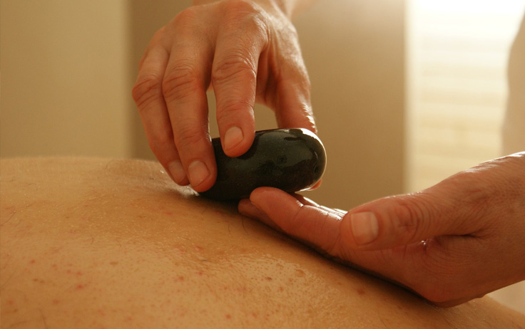 A specialty massage that uses smooth, heated stones, either as an extension with the massage, or by placing them on the body. The heat can be both deeply relaxing and help warm up tight muscles so the therapist can work more deeply and more quickly without it being overly painful for deep tissue routines.